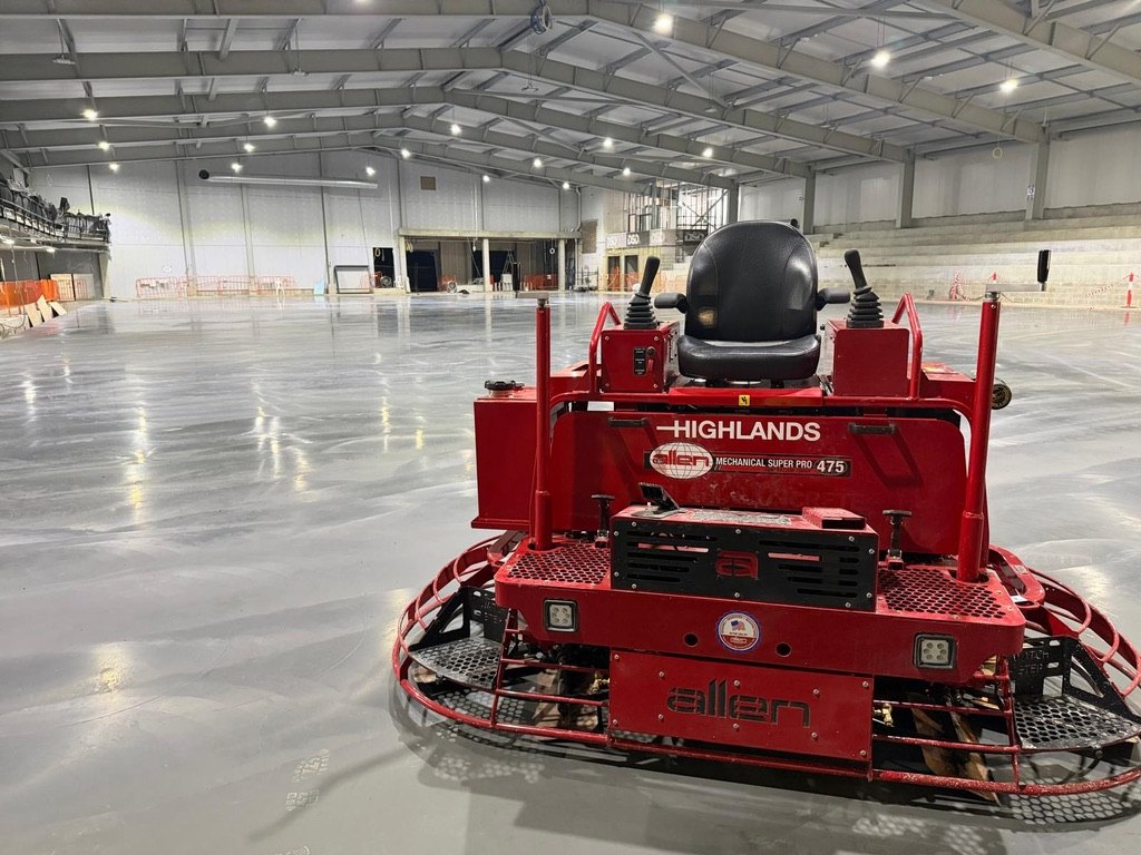 Highlands Allen MSP475 ride-on trowel on the finished competition ice rink slab