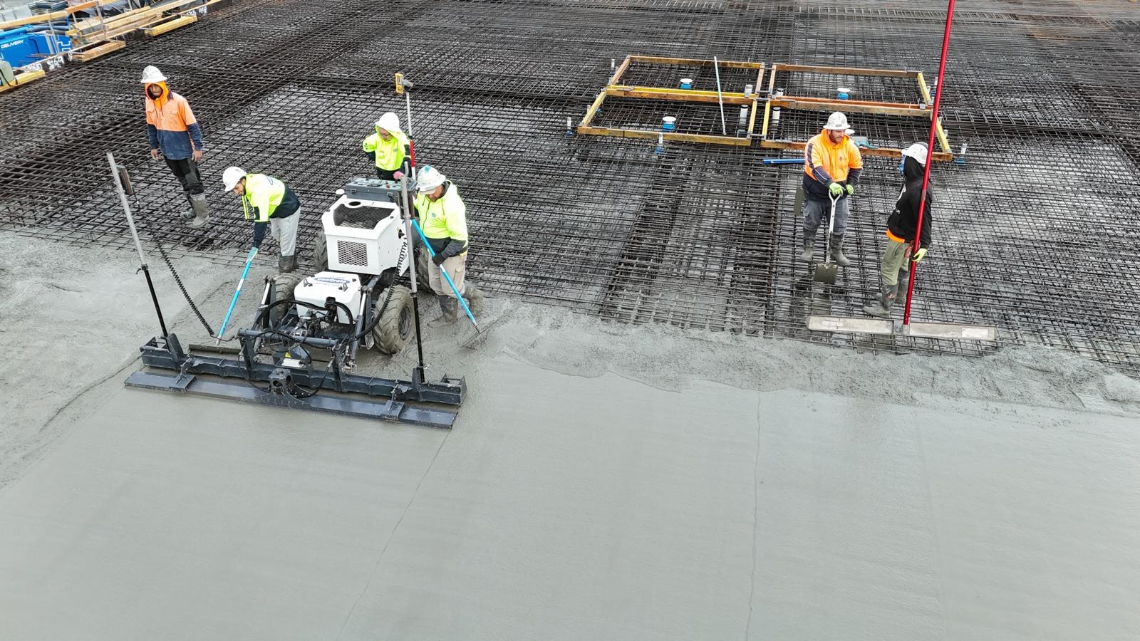 Laser screed crew levelling a deck pour