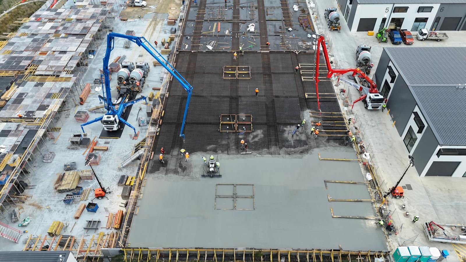 Industrial estate warehouse floor pour, aerial drone view